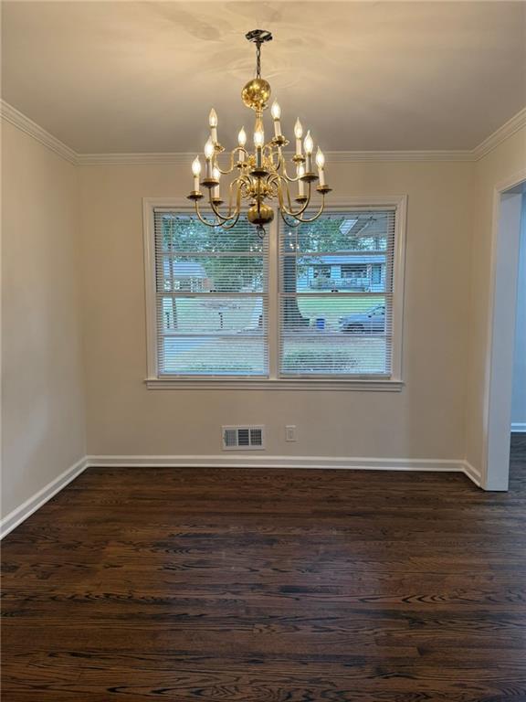 3085 Stantondale Drive Atlanta, GA 30341 - Photo 6 of 20 a view of a room with wooden floor chandelier and white walls