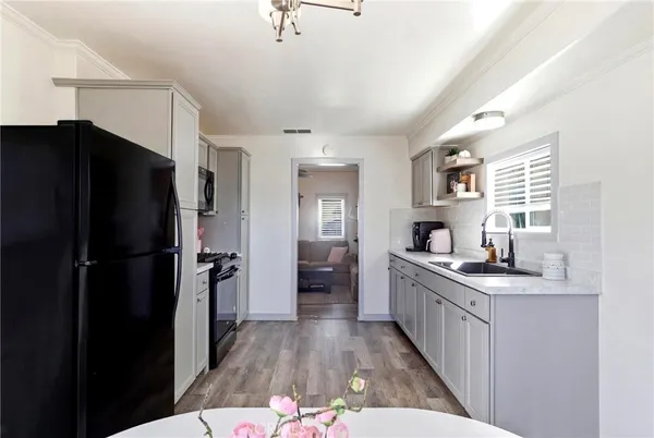 a kitchen with stainless steel appliances granite countertop a stove and a microwave