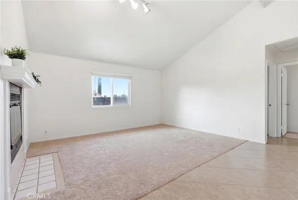 a living room with a couch and a window