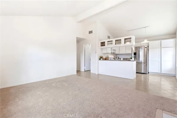 a kitchen with stainless steel appliances granite countertop a sink and cabinets