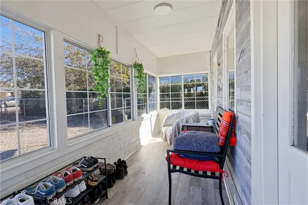 a balcony with furniture and garden
