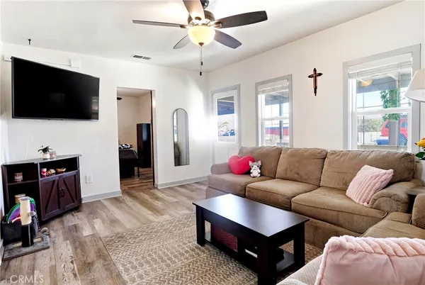 a living room with furniture and a large window
