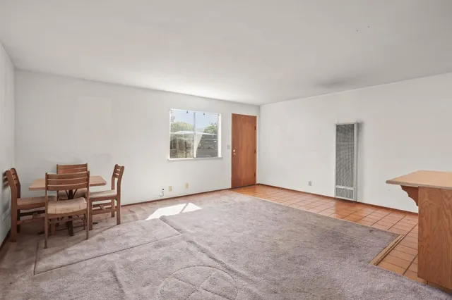 a view of workspace room with wooden floor and windows