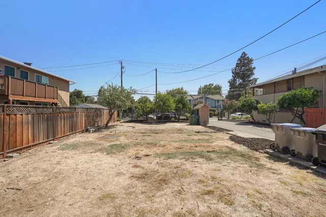 a view of a backyard of the house