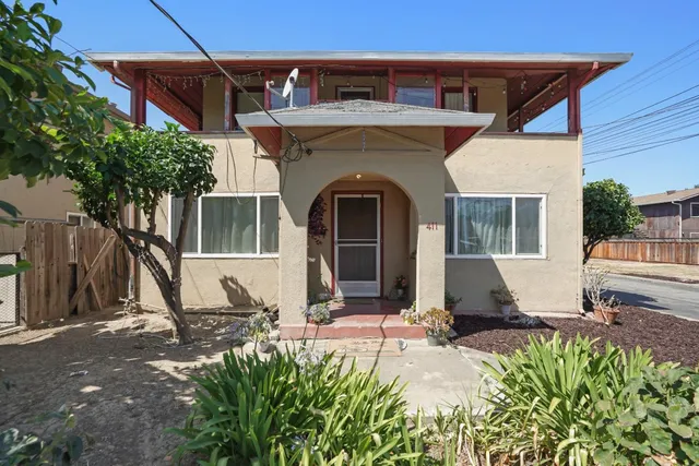 a front view of a house with garden