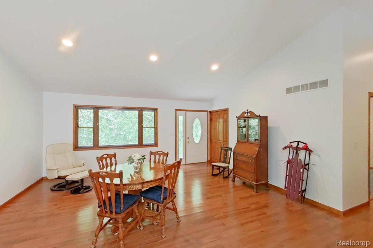 10201 Washburn Road Goodrich, MI 48438 - Photo 34 of 85 Spacious room featuring wood-finish flooring, recessed lighting, and a large window with wood trim