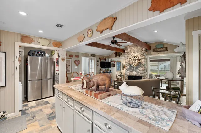 a lobby with furniture and chandelier