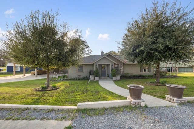 a front view of a house with garden