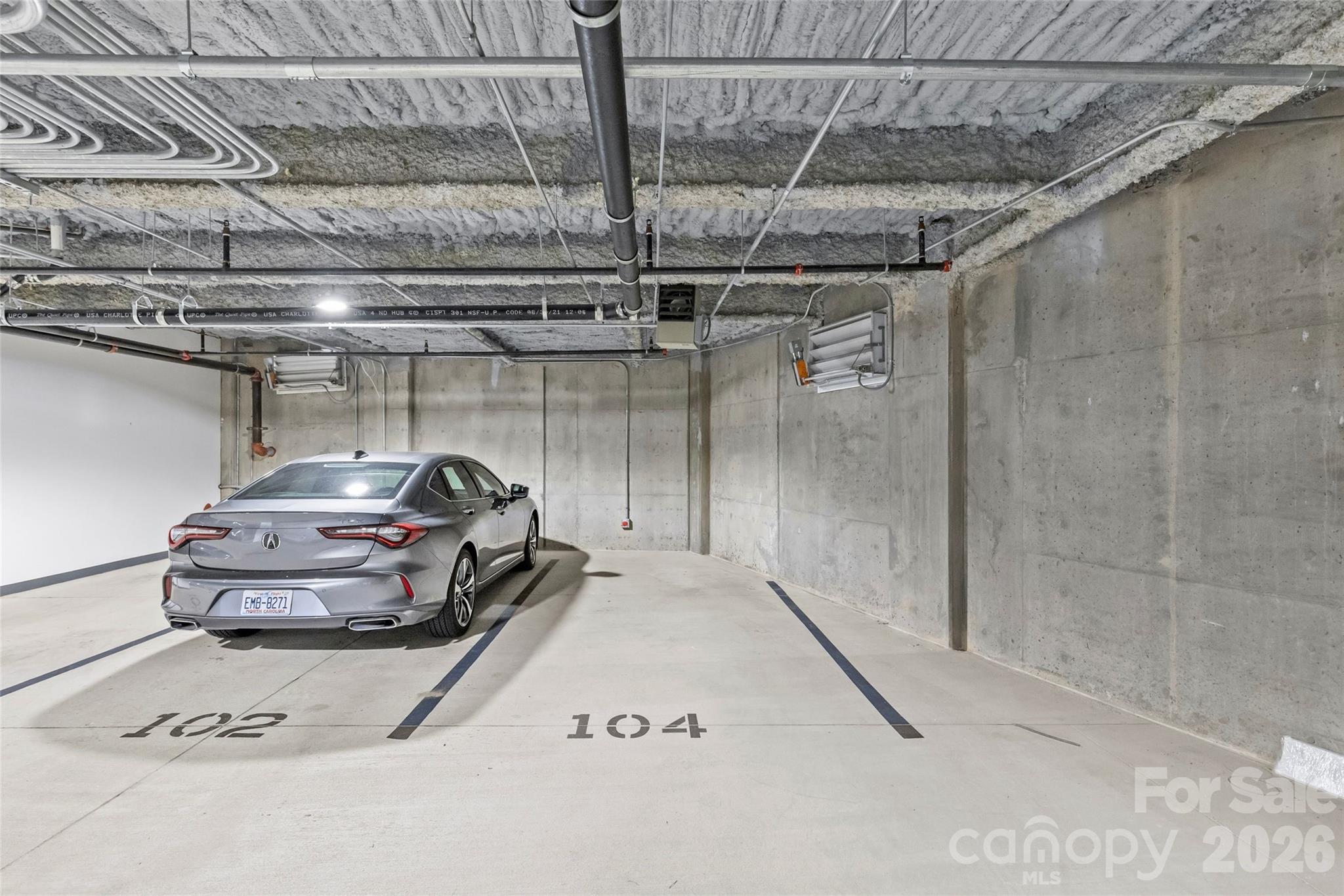 1500 Queens Road, Unit 104 Charlotte, NC 28207 - Photo 32 of 41 a car parked in a parking