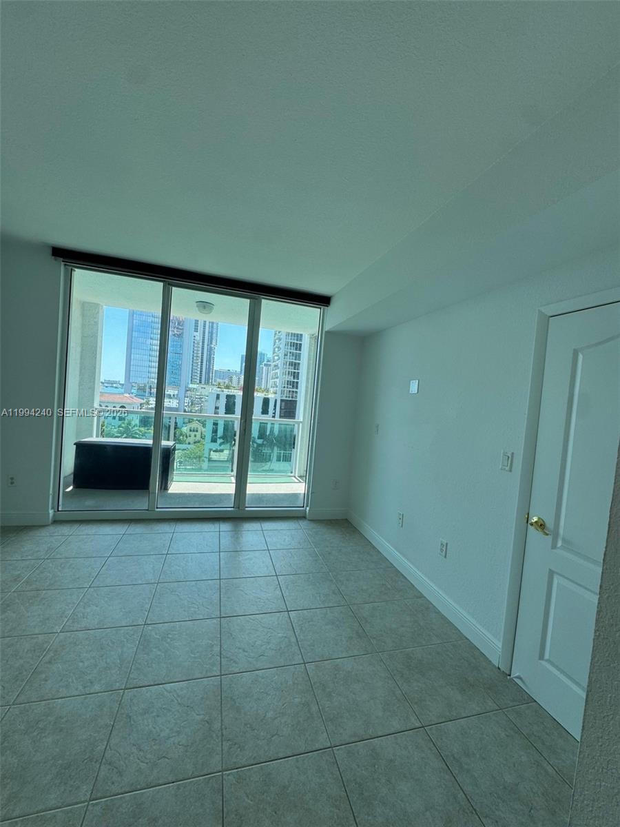 500 Northeast 29th Street, Unit 907 Miami, FL 33137 - Photo 4 of 8 a view of an empty room with a window