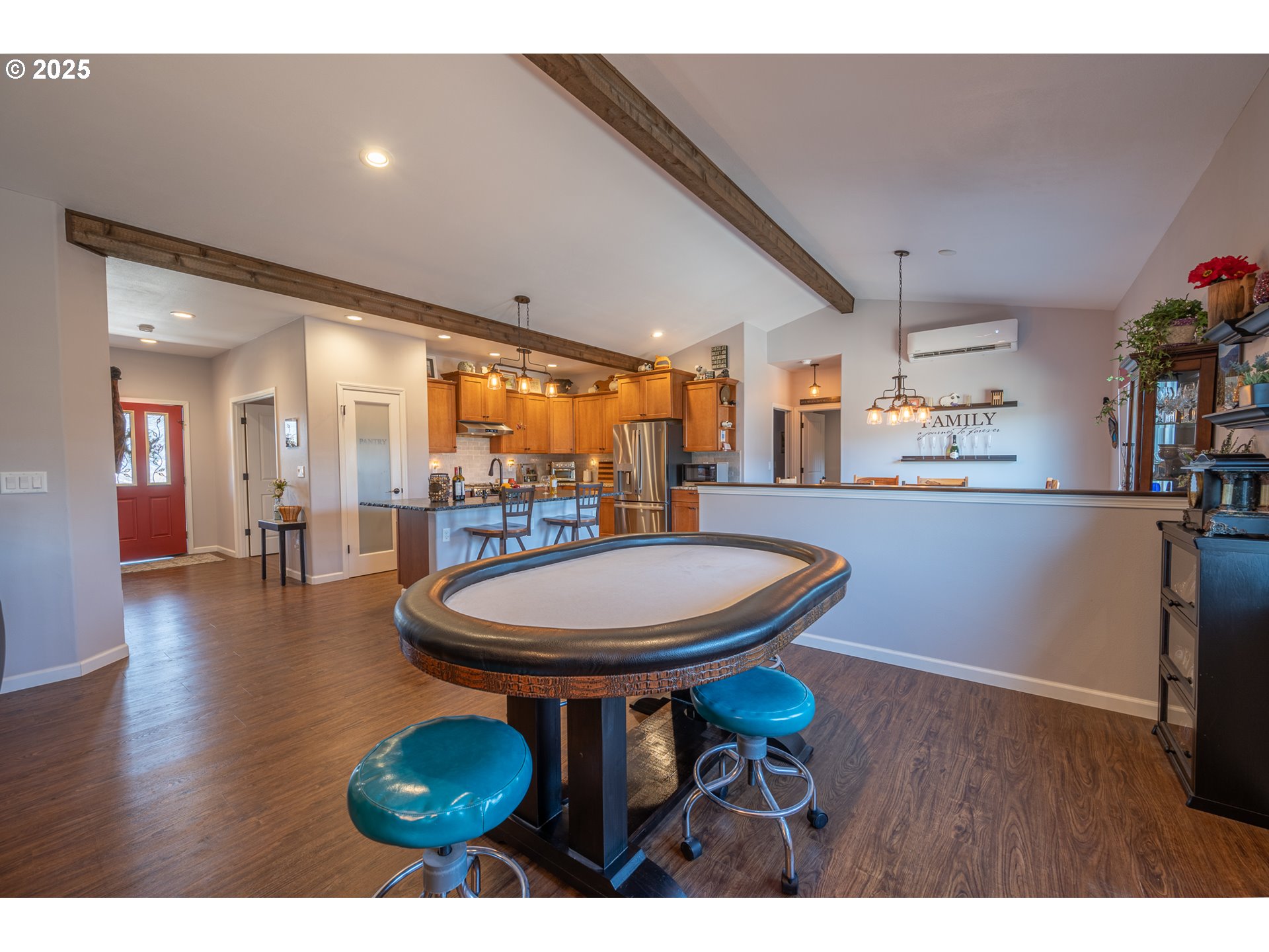 2686 Cedar Loop Bandon, OR 97411 - Photo 15 of 42 a view of a dining room with furniture and wooden floor