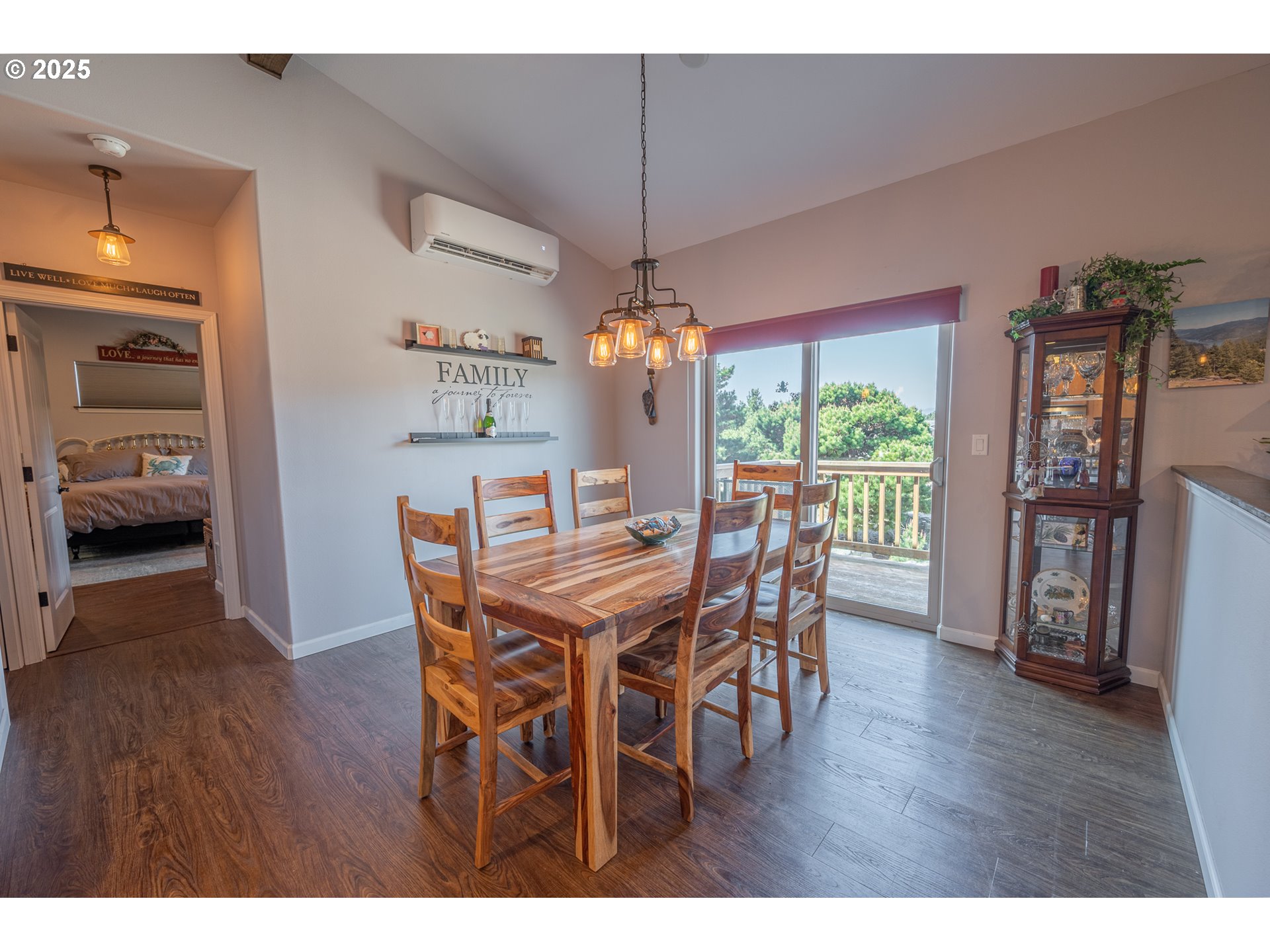 2686 Cedar Loop Bandon, OR 97411 - Photo 21 of 42 a dining room with furniture window and wooden floor