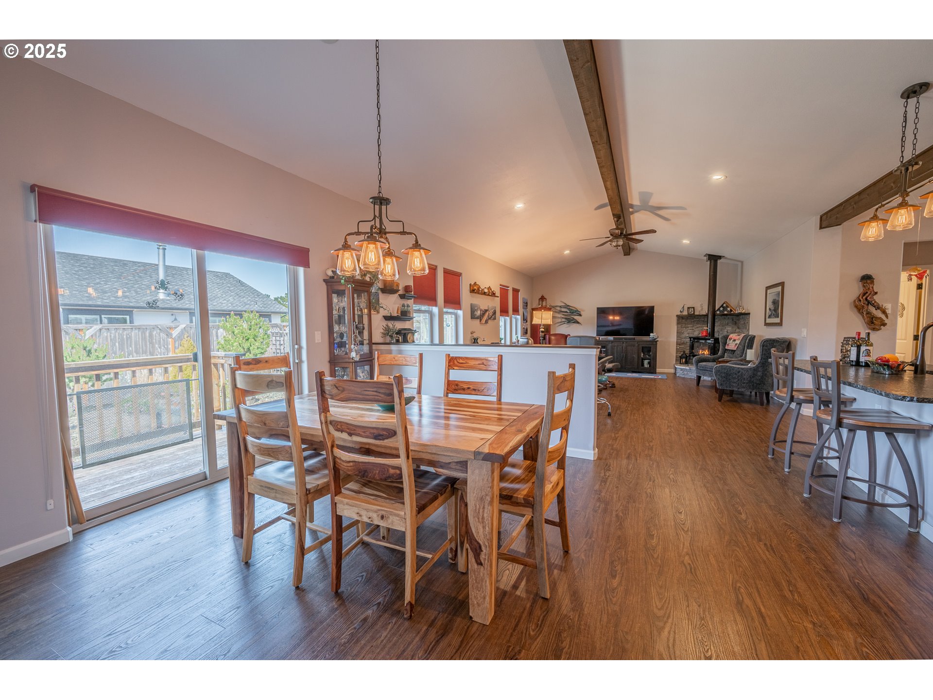 2686 Cedar Loop Bandon, OR 97411 - Photo 22 of 42 a view of a dining room with furniture window and wooden floor