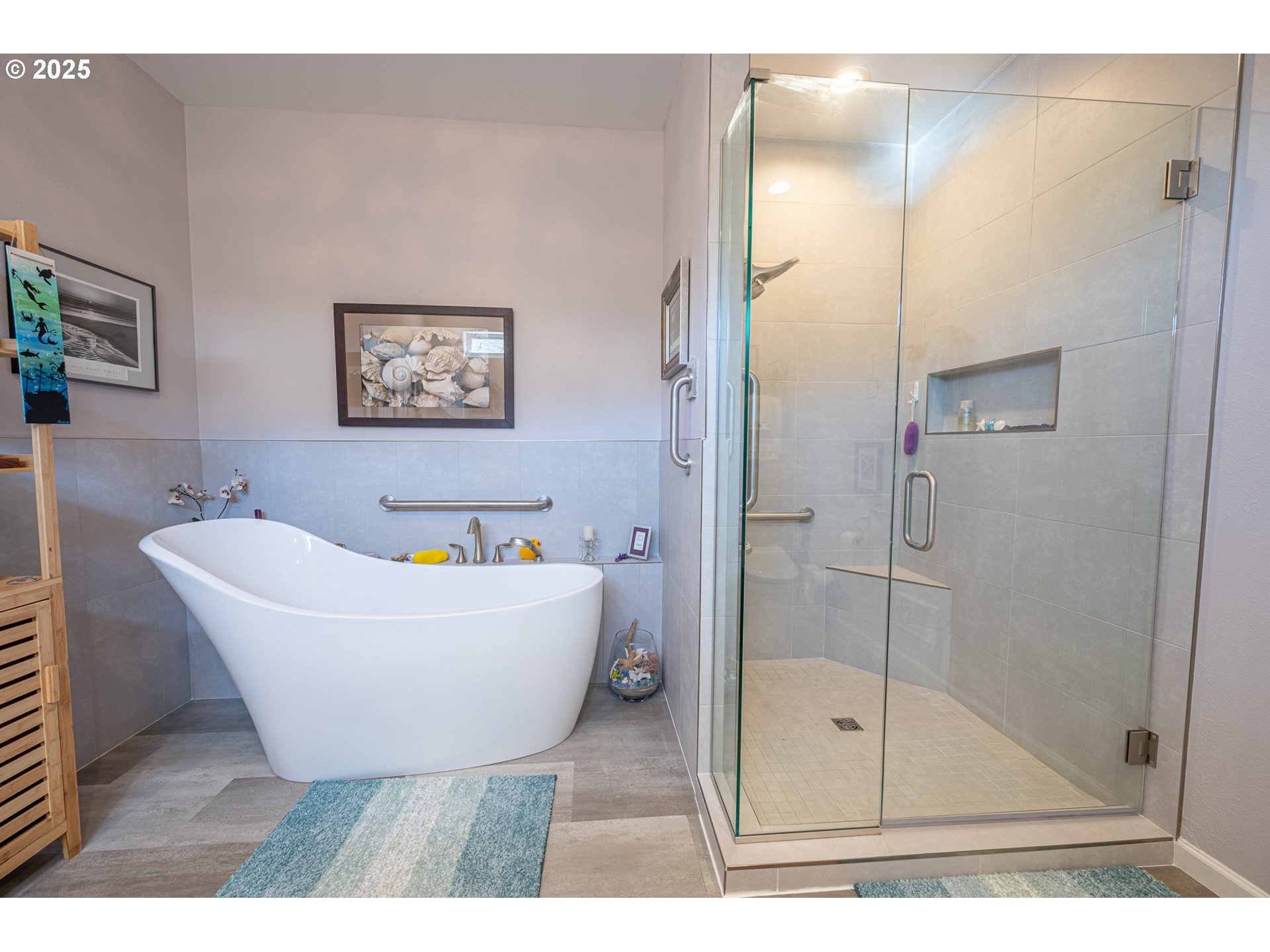 2686 Cedar Loop Bandon, OR 97411 - Photo 27 of 42 a bathroom with a bathtub and shower