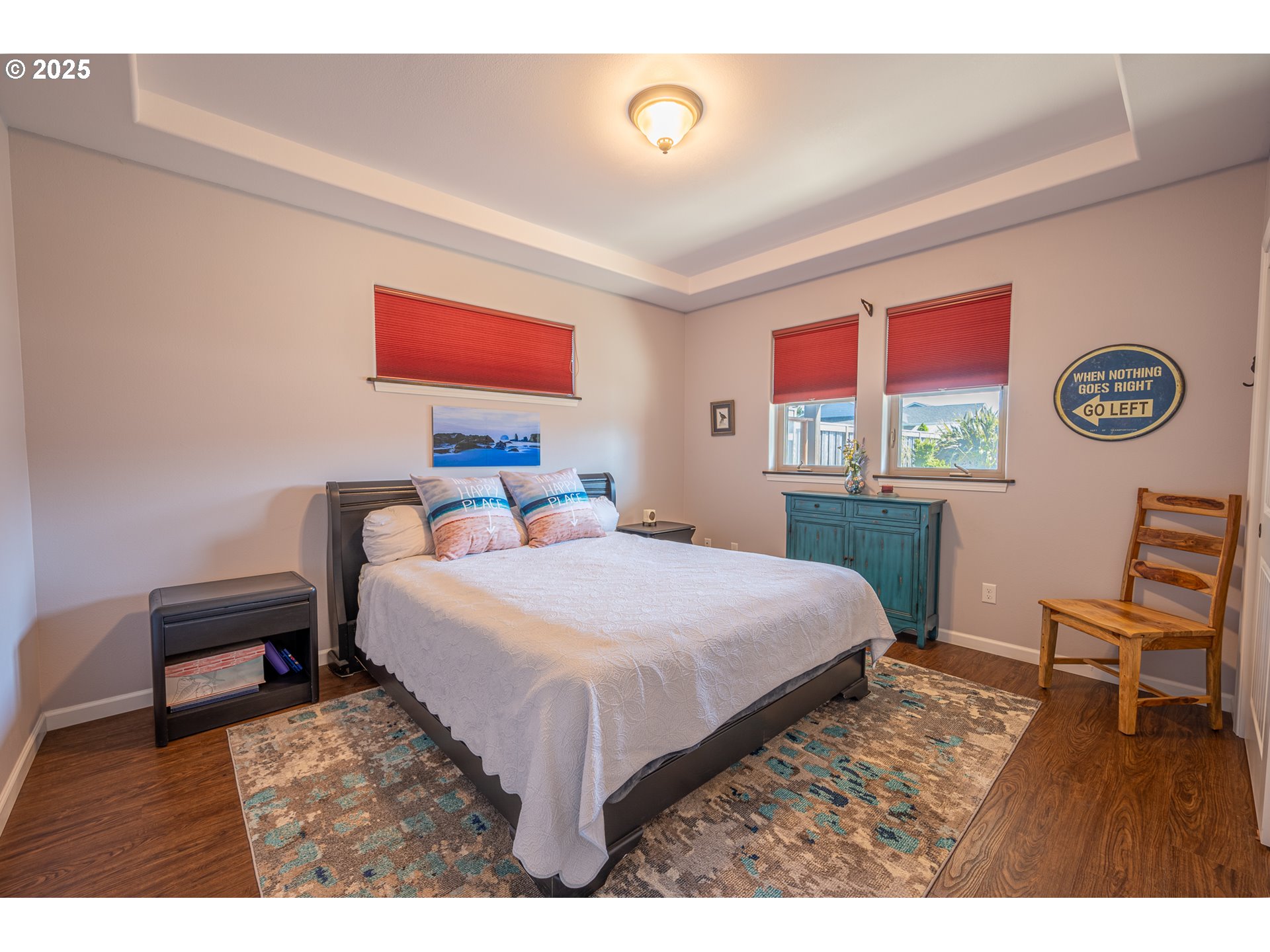 2686 Cedar Loop Bandon, OR 97411 - Photo 32 of 42 a bedroom with a bed and a chair