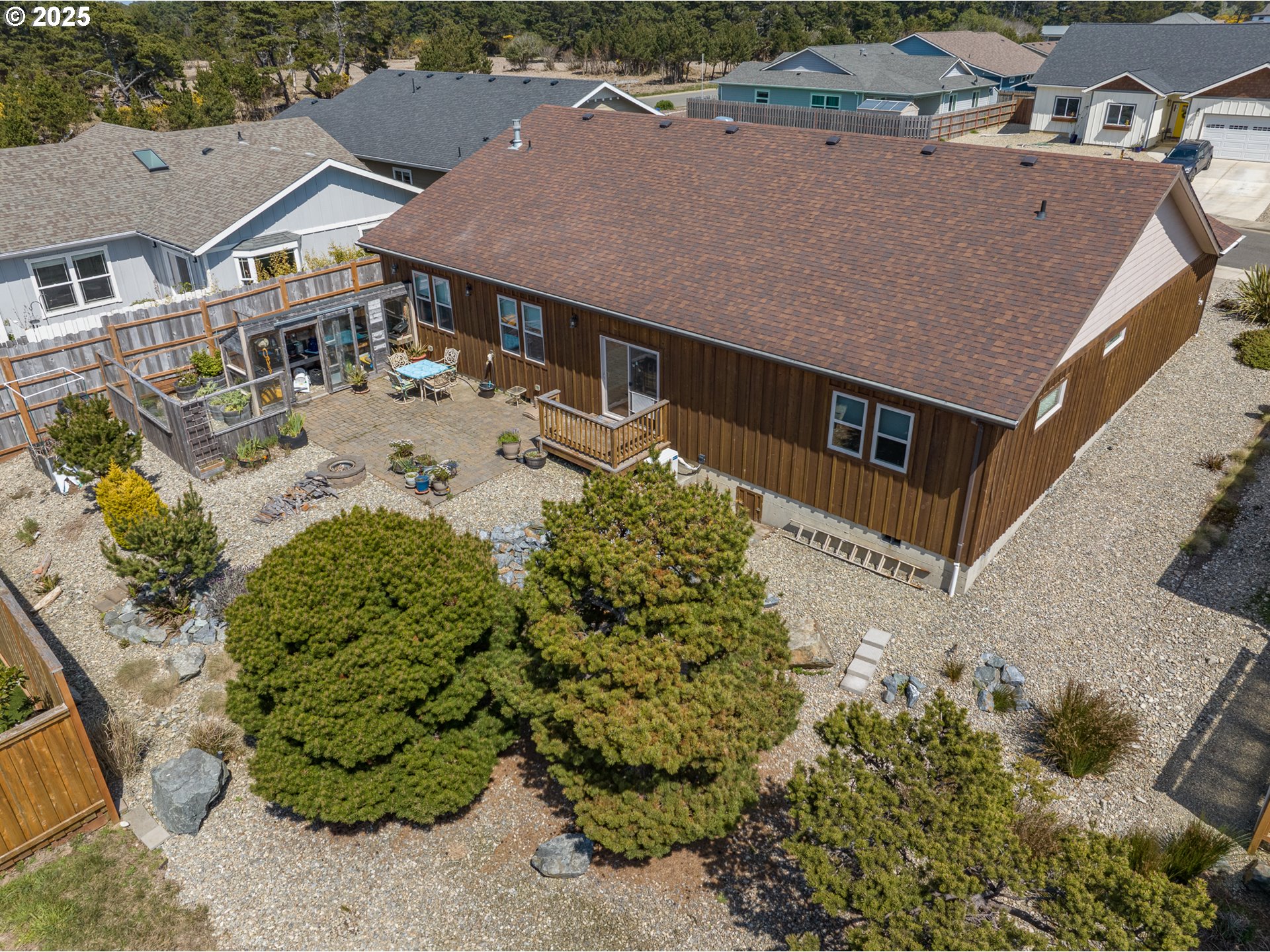 2686 Cedar Loop Bandon, OR 97411 - Photo 35 of 42 an aerial view of a house with a yard