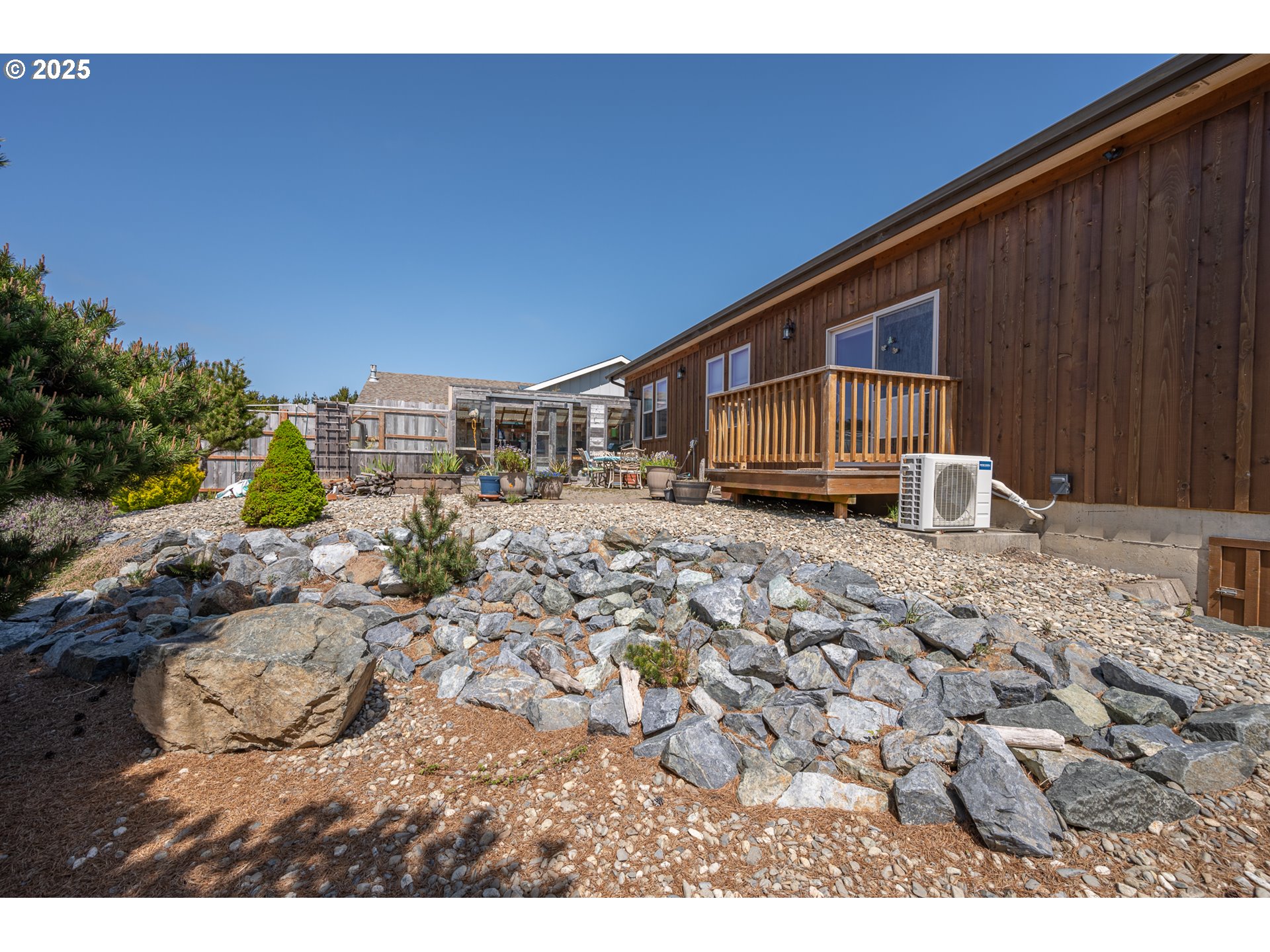 2686 Cedar Loop Bandon, OR 97411 - Photo 36 of 42 a picture of a house with a yard
