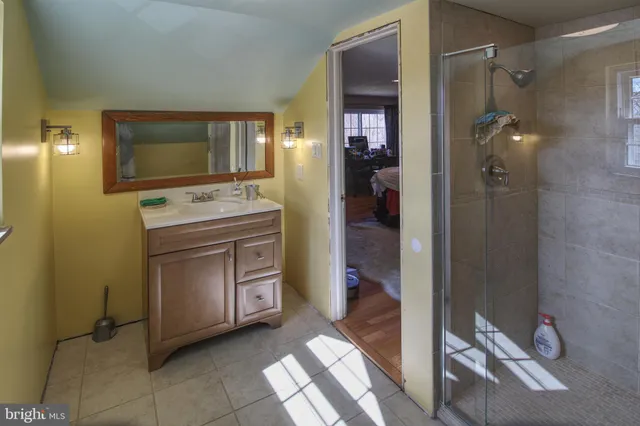 a kitchen with a refrigerator and a sink