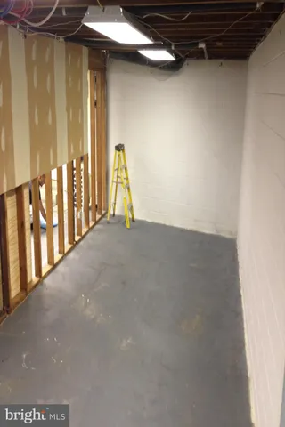 a view of a hallway with seating area