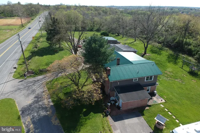 a aerial view of a house with a yard