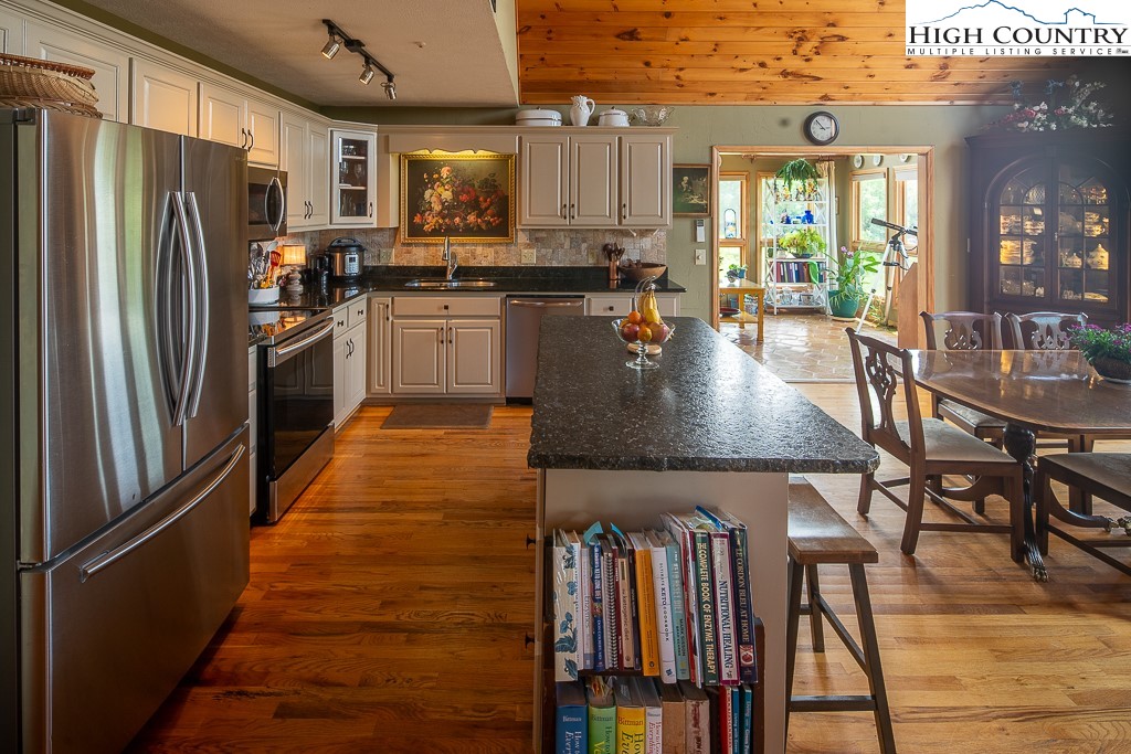 980 Scenic Drive Vilas, NC 28692 - Photo 12 of 42 a kitchen with stainless steel appliances granite countertop a refrigerator a stove and a sink