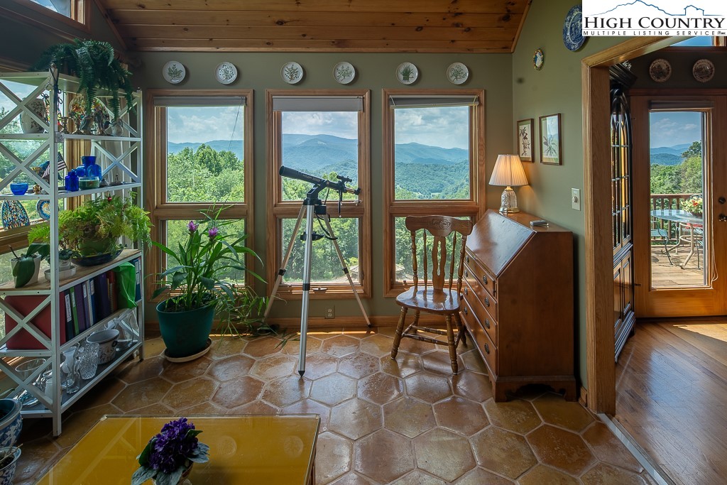 980 Scenic Drive Vilas, NC 28692 - Photo 15 of 42 a view of a porch with chairs and potted plants