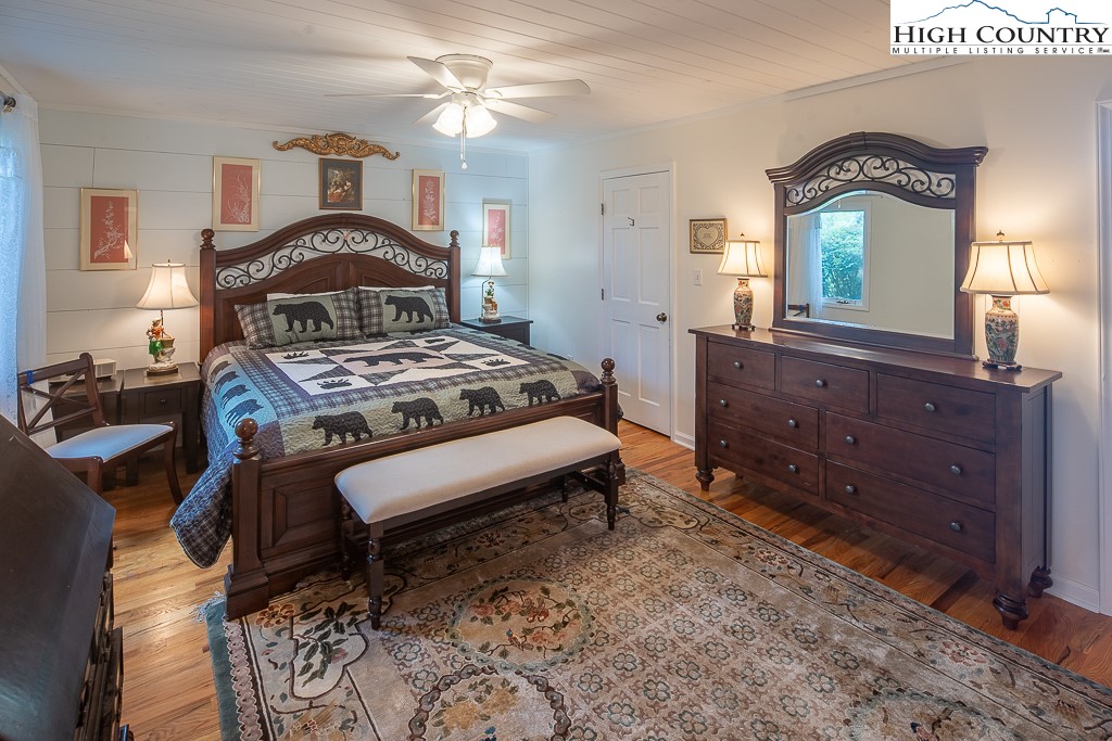 980 Scenic Drive Vilas, NC 28692 - Photo 17 of 42 a bedroom with a bed and a dresser