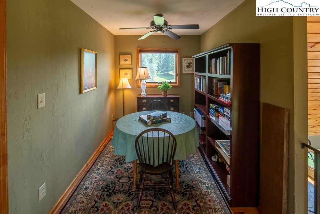 980 Scenic Drive Vilas, NC 28692 - Photo 20 of 42 a view of a workspace with furniture and a window