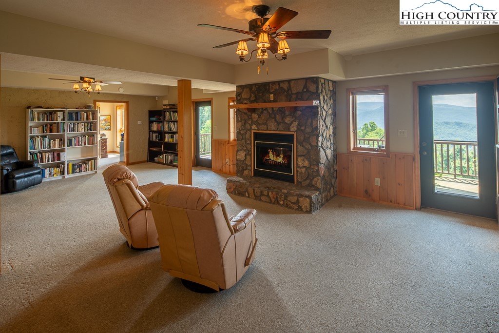 980 Scenic Drive Vilas, NC 28692 - Photo 25 of 42 a living room with furniture and a fireplace