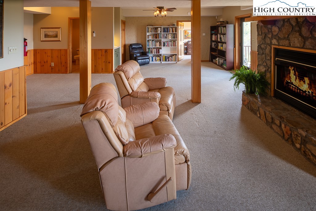 980 Scenic Drive Vilas, NC 28692 - Photo 27 of 42 a living room with furniture and a fireplace