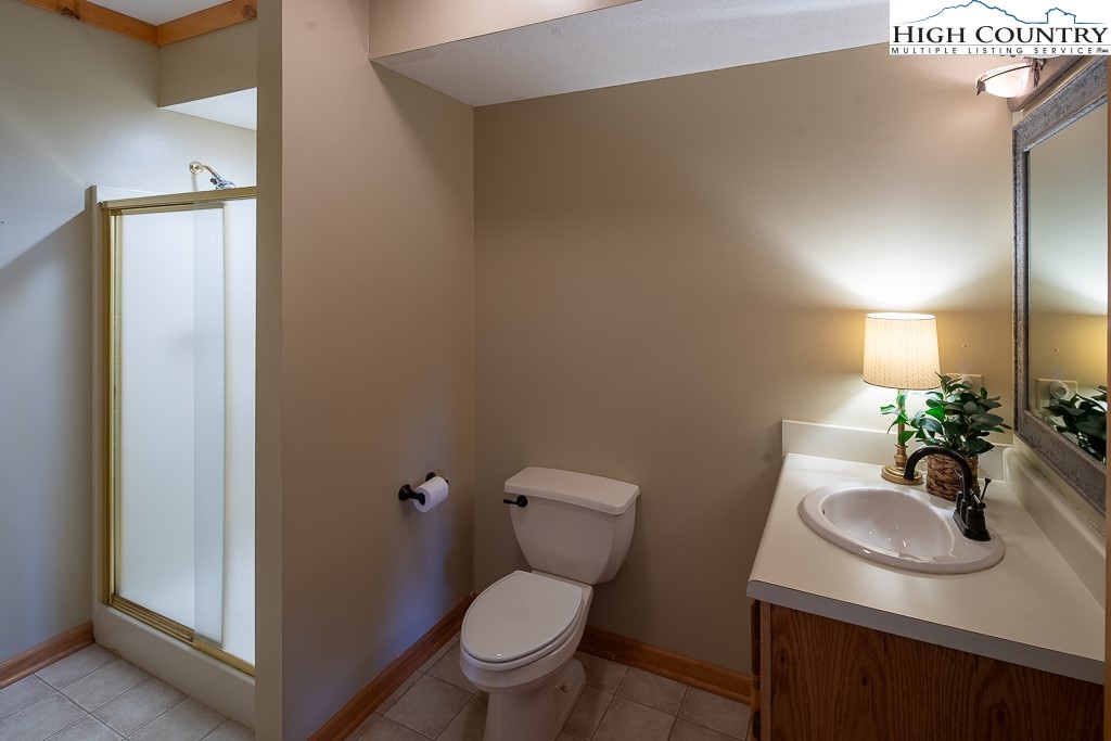 980 Scenic Drive Vilas, NC 28692 - Photo 32 of 42 a bathroom with a sink toilet and a mirror