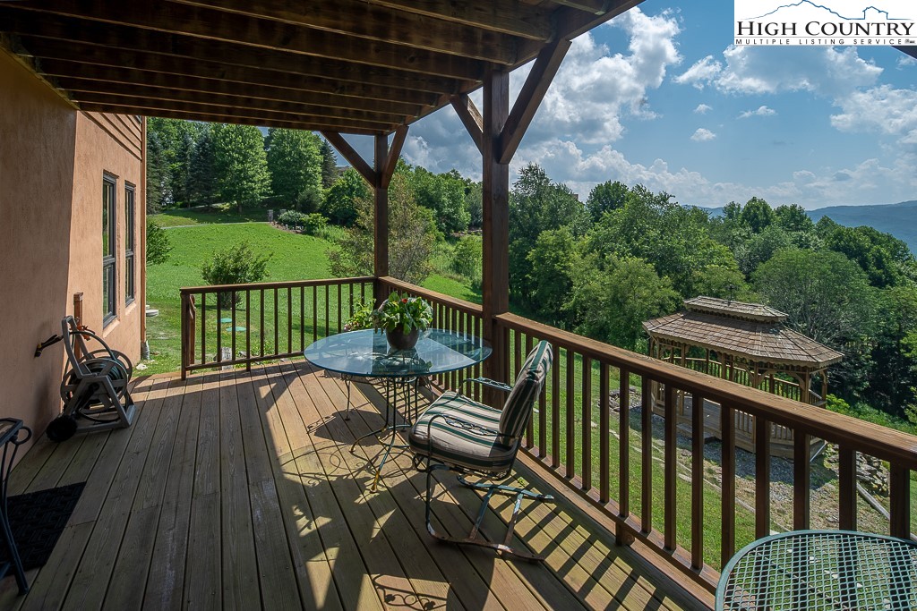 980 Scenic Drive Vilas, NC 28692 - Photo 37 of 42 a view of balcony with furniture and wooden deck