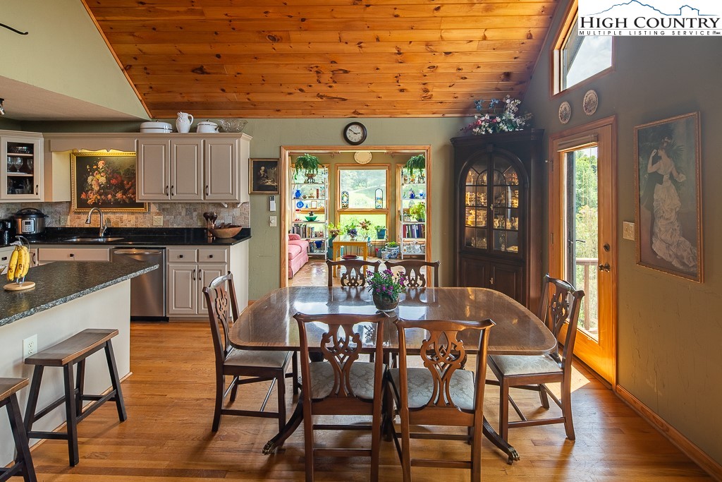 980 Scenic Drive Vilas, NC 28692 - Photo 9 of 42 a view of a dining room with furniture window and wooden floor