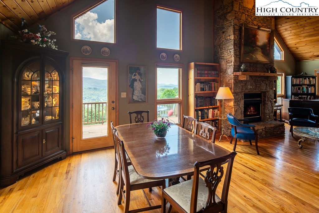 980 Scenic Drive Vilas, NC 28692 - Photo 10 of 42 a view of a dining room with furniture window and wooden floor