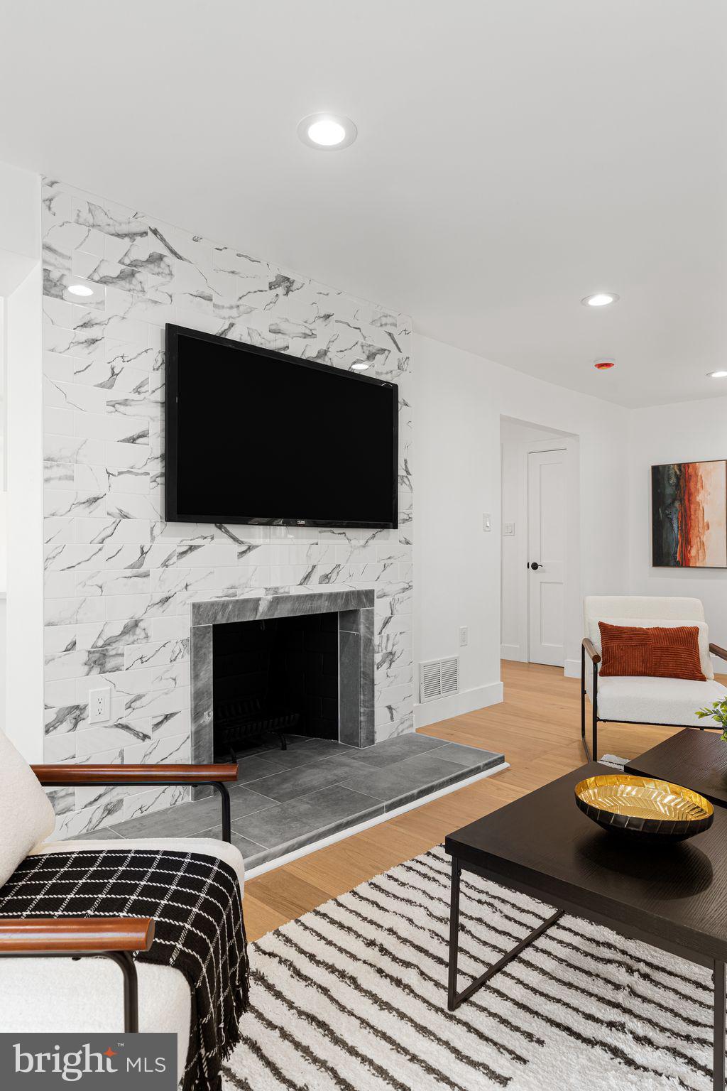 726 Darby Paoli Road Newtown Square, PA 19073 - Photo 16 of 55 a living room with a flat screen tv and a fireplace