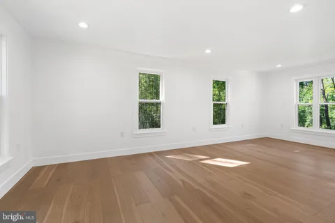 a view of a dining room with furniture and window