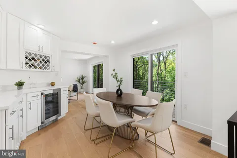 a dinning room with a table and chairs