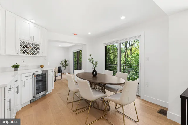 a dinning room with a table and chairs