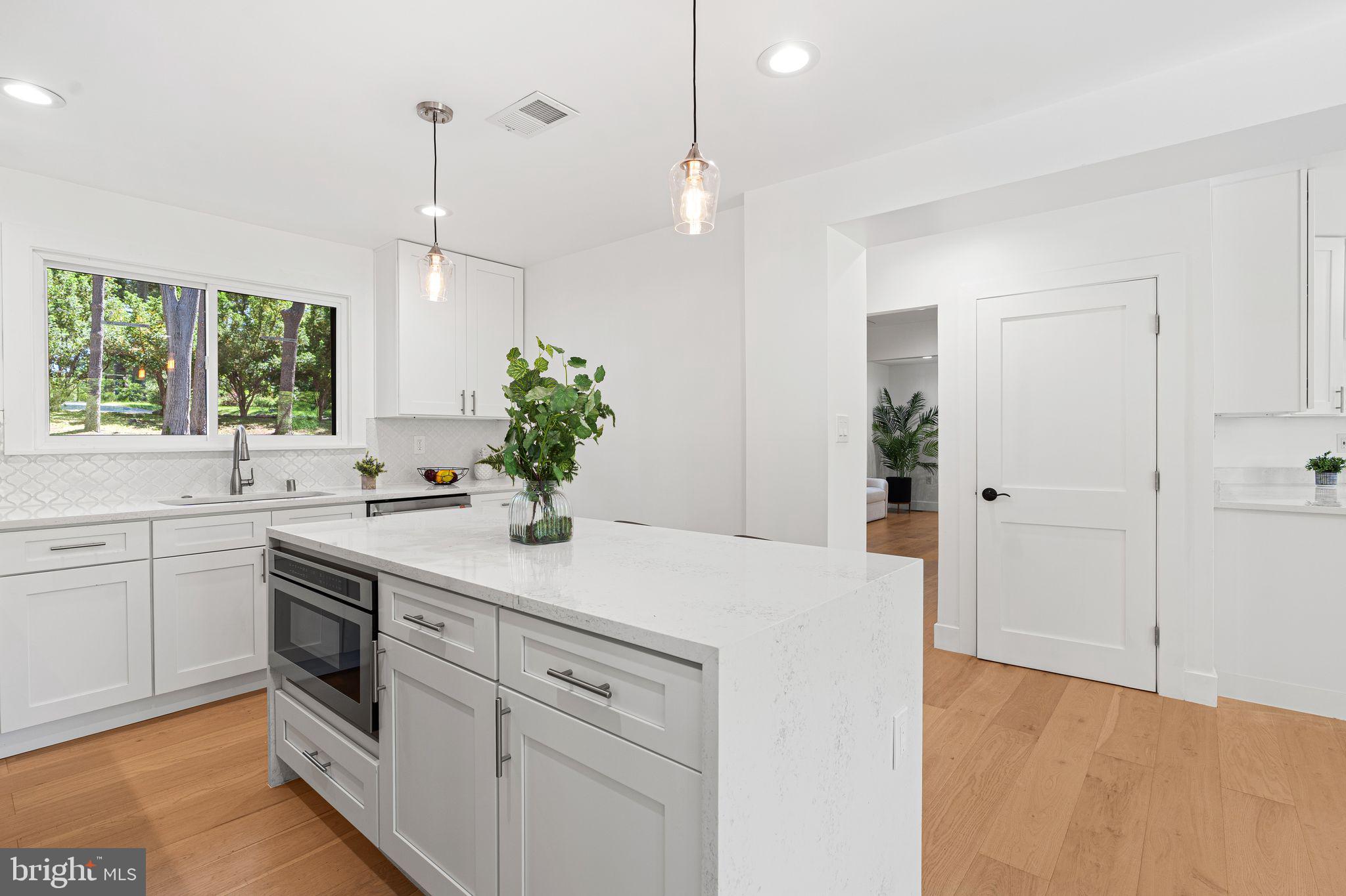726 Darby Paoli Road Newtown Square, PA 19073 - Photo 28 of 55 a kitchen with white cabinets and white appliances