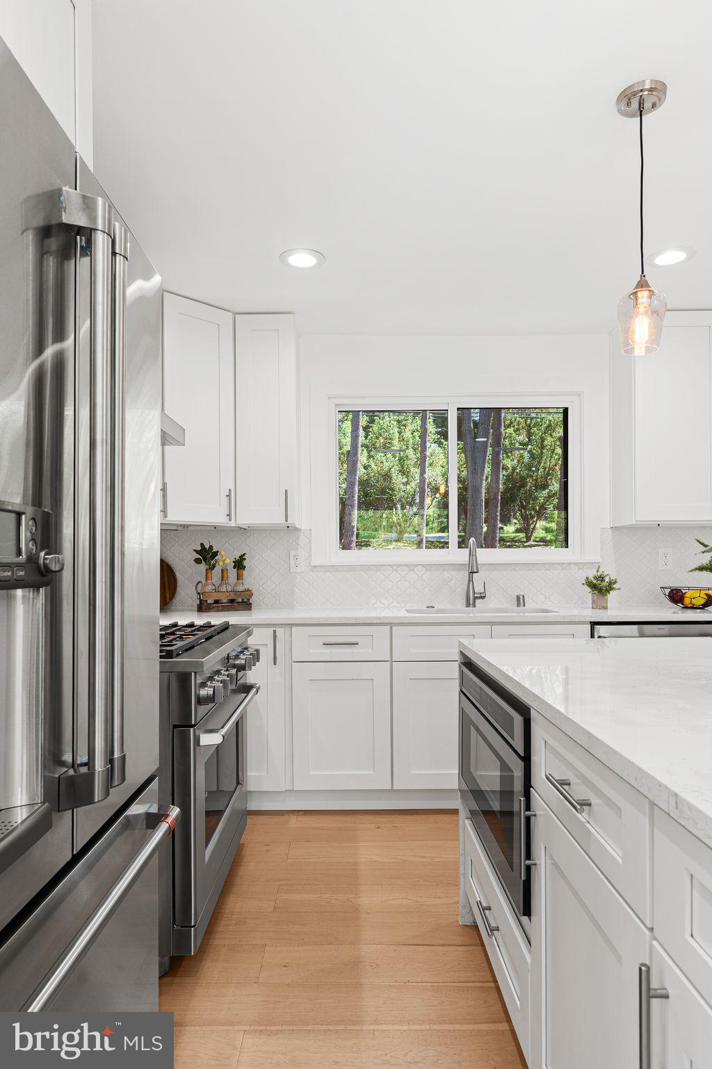 726 Darby Paoli Road Newtown Square, PA 19073 - Photo 29 of 55 a kitchen with a sink stove and refrigerator