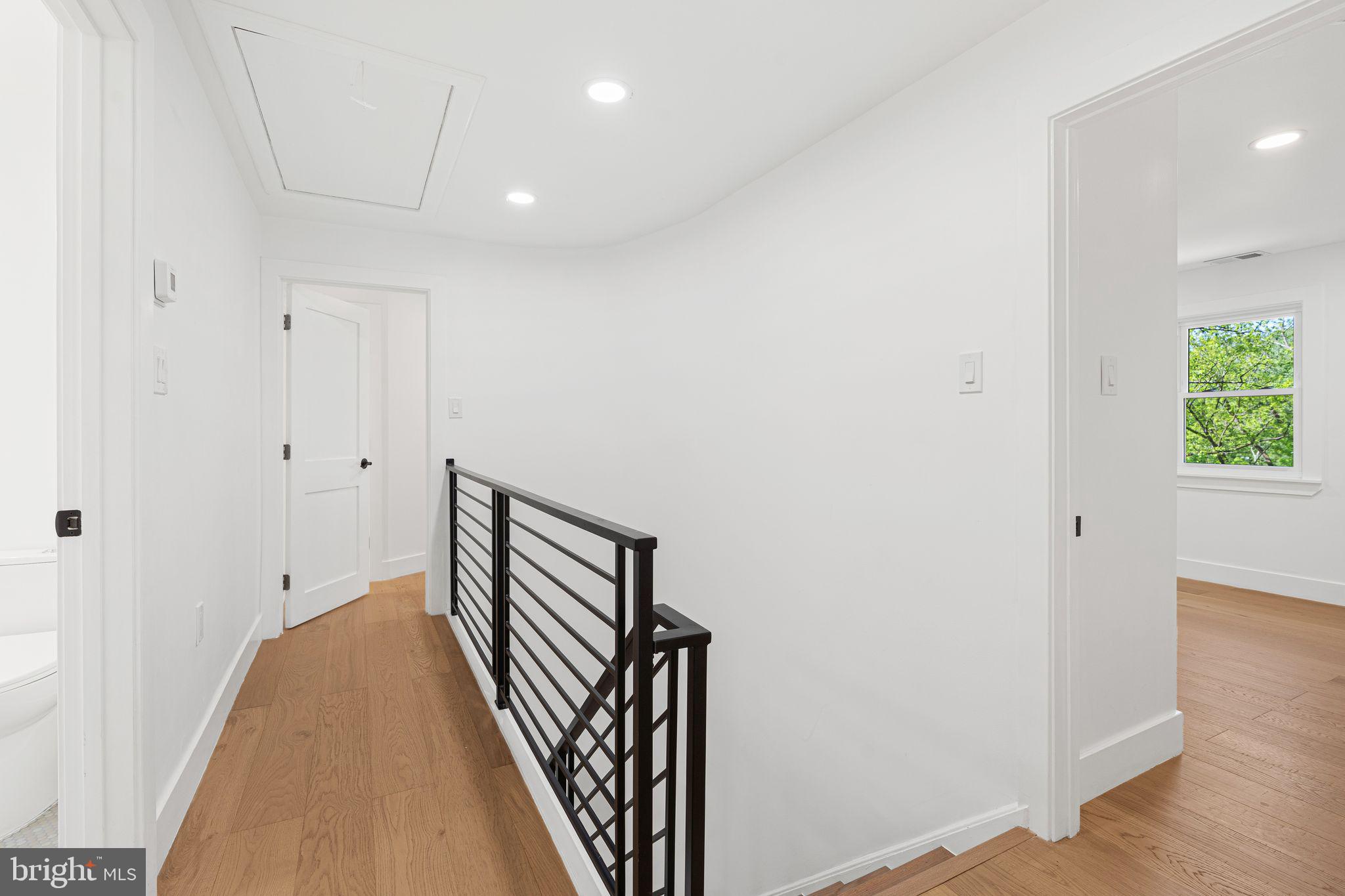 726 Darby Paoli Road Newtown Square, PA 19073 - Photo 36 of 55 a view of a hallway with wooden floor and stairs