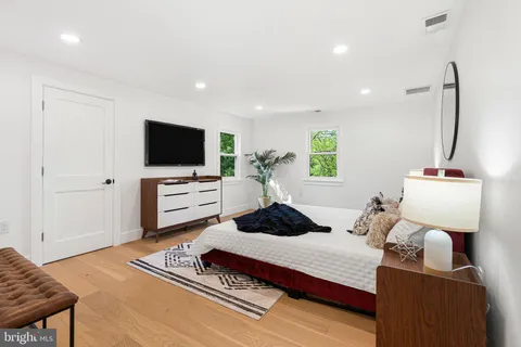 a bathroom with a sink a mirror and window