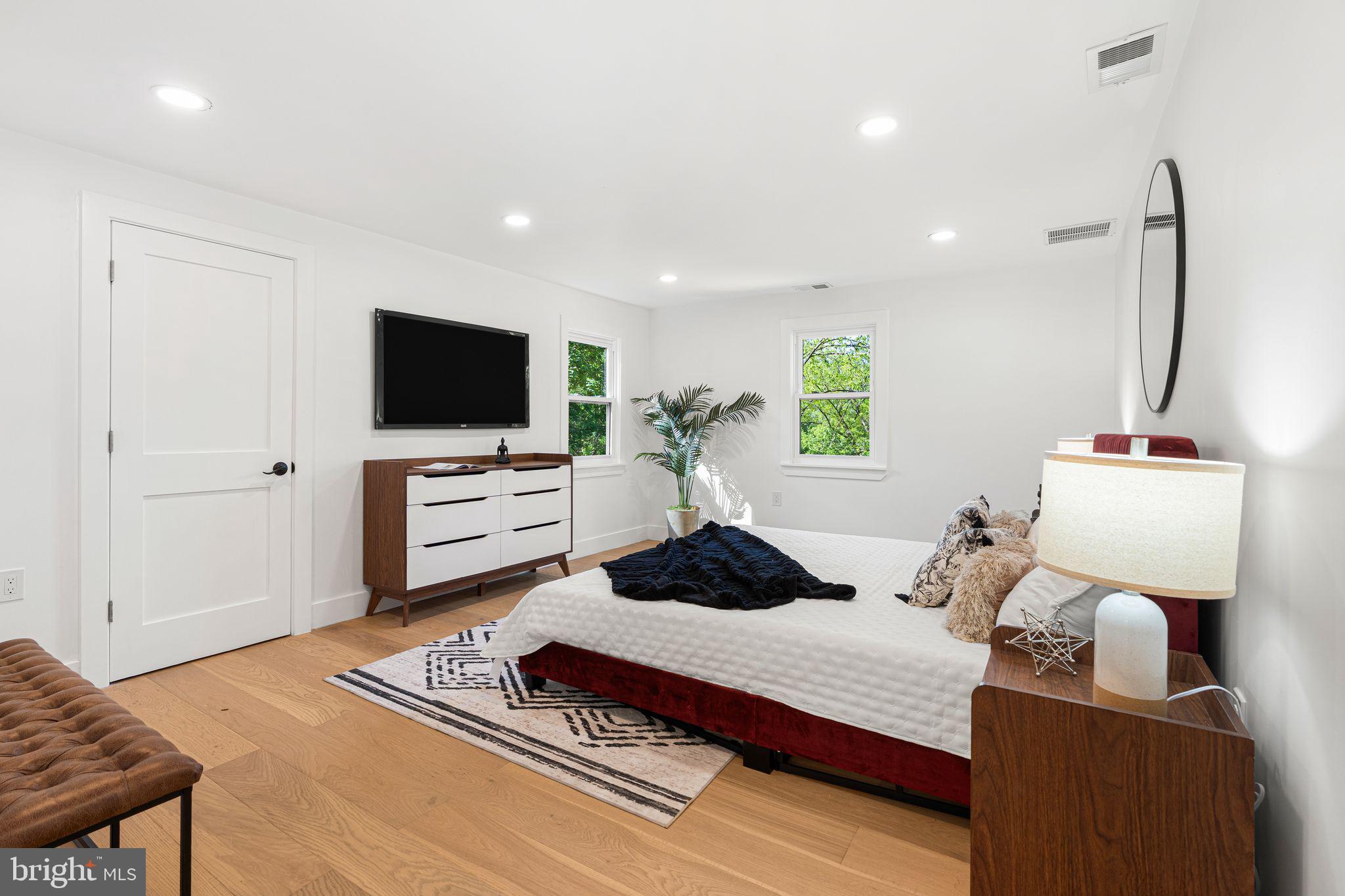 726 Darby Paoli Road Newtown Square, PA 19073 - Photo 39 of 55 a bedroom with furniture and a flat screen tv