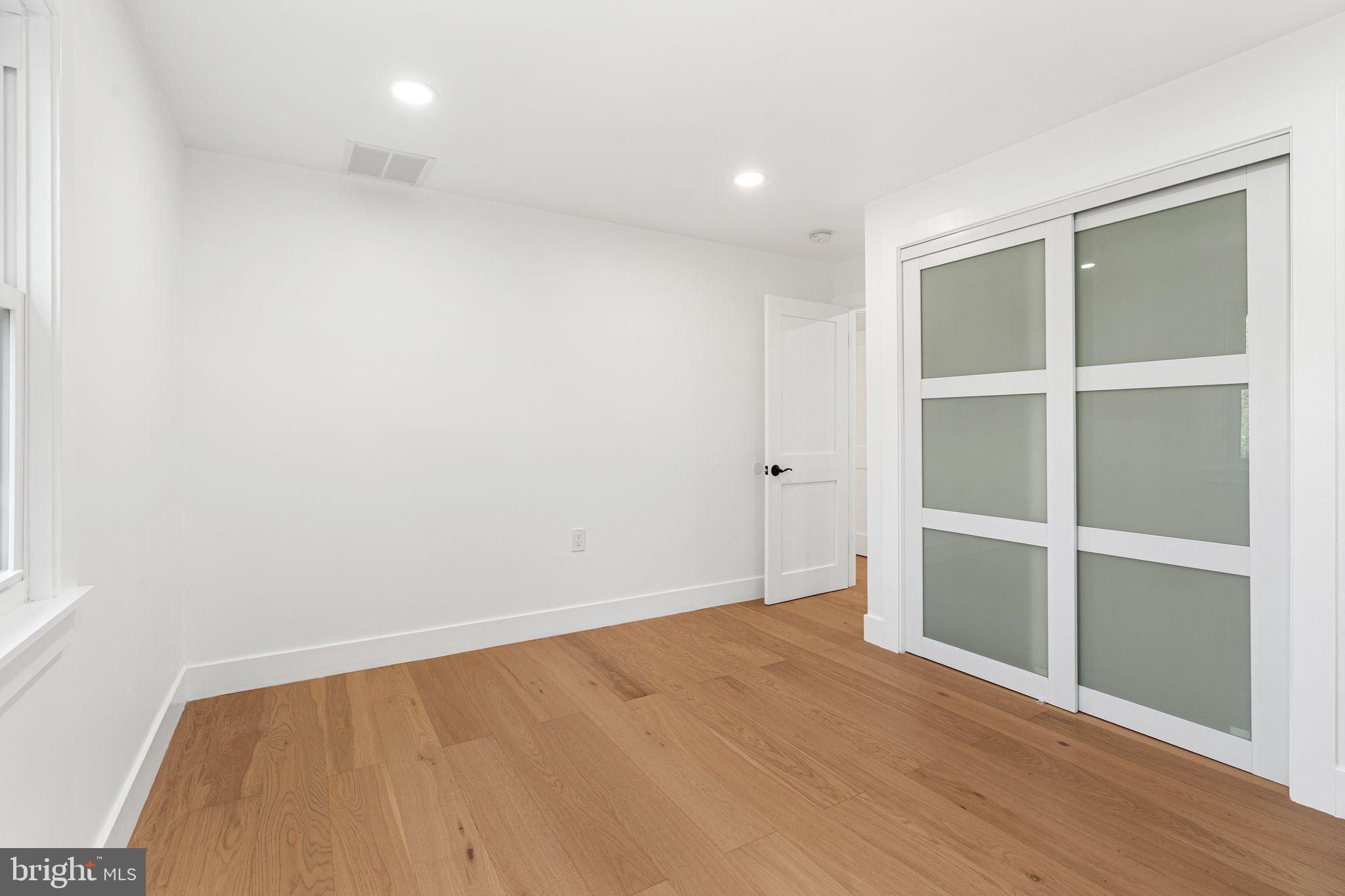 726 Darby Paoli Road Newtown Square, PA 19073 - Photo 53 of 55 a view of an empty room with wooden floor and closet