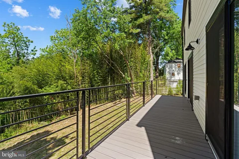 a view of balcony and wooden floor