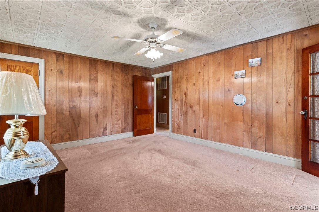 4000 Wayside Road Charles City, VA 23030 - Photo 5 of 30 a view of a livingroom with a chandelier fan and kitchen view