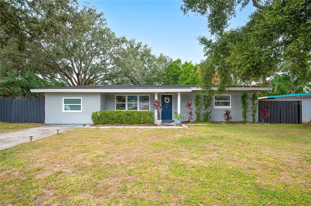 129 Longfellow Road Winter Haven, FL 33884 - Photo 1 of 1 front view of a house with a patio