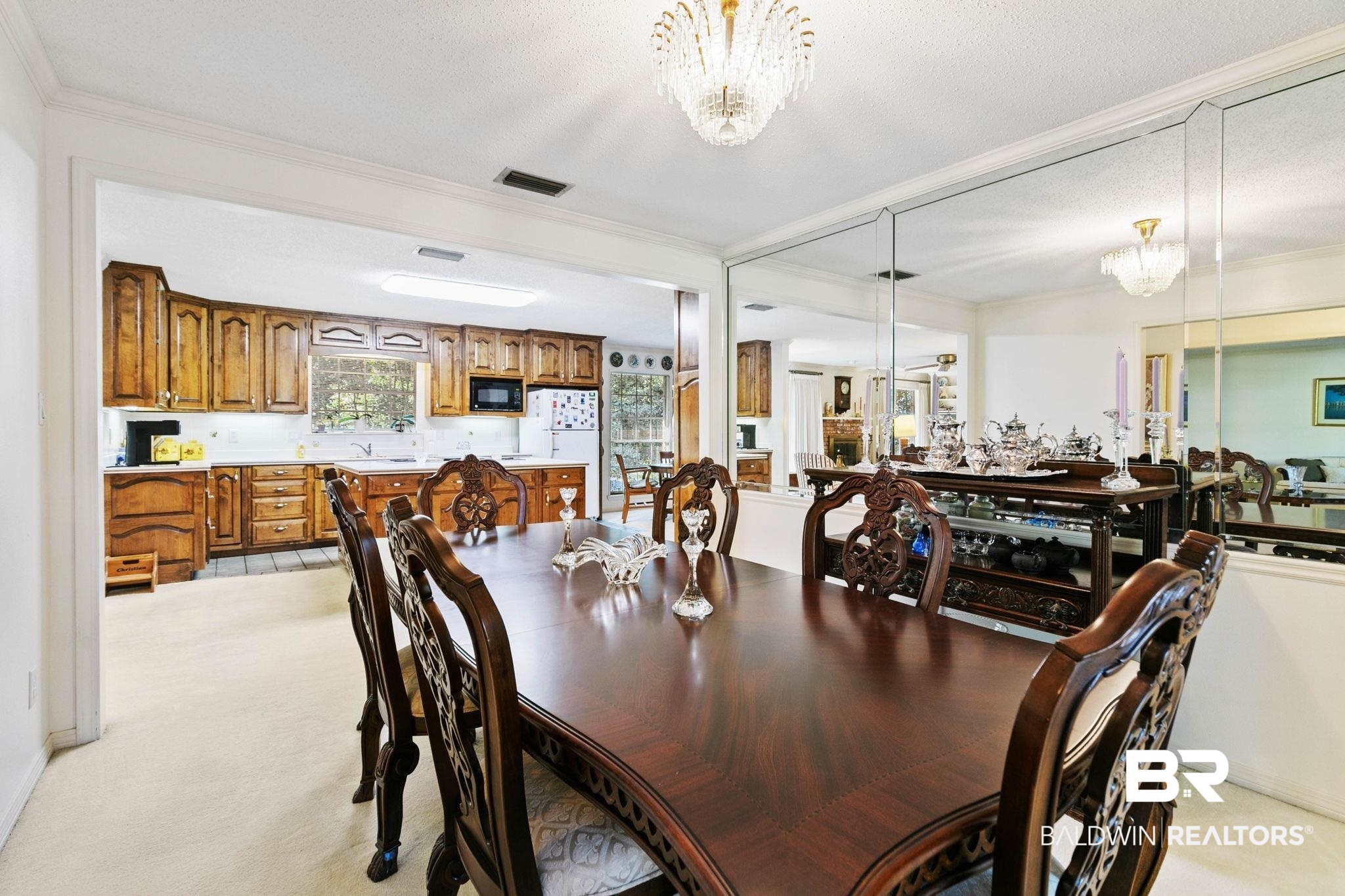 752 Evergreen Street Fairhope, AL 36532 - Photo 4 of 100 Dining area featuring a chandelier, ornamental molding, and light colored carpet