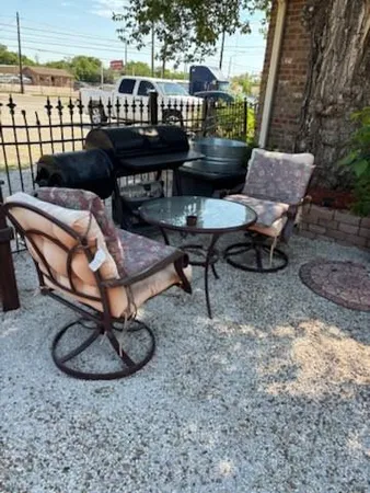a view of a chairs and tables in the terrace