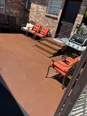 a backyard of a house with chairs